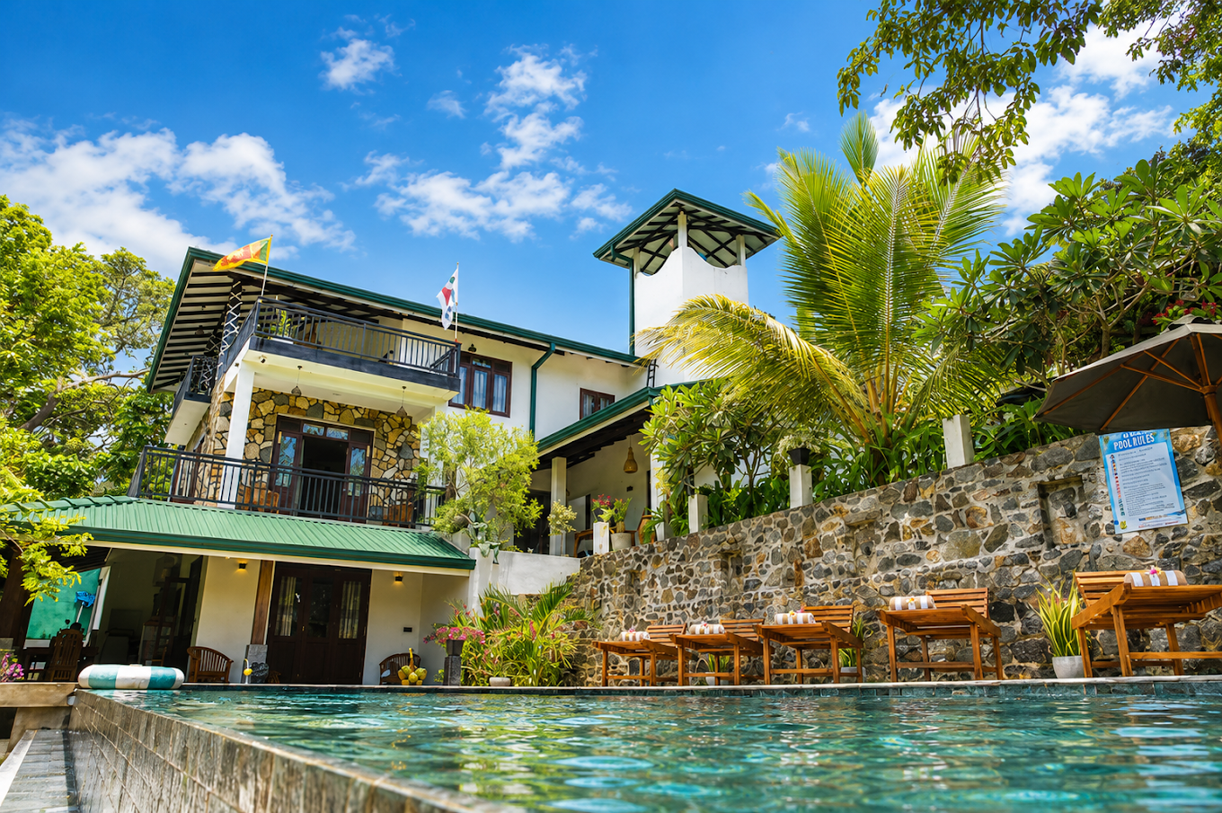 Monkey Island Villa and poolside loungers in the sunshine